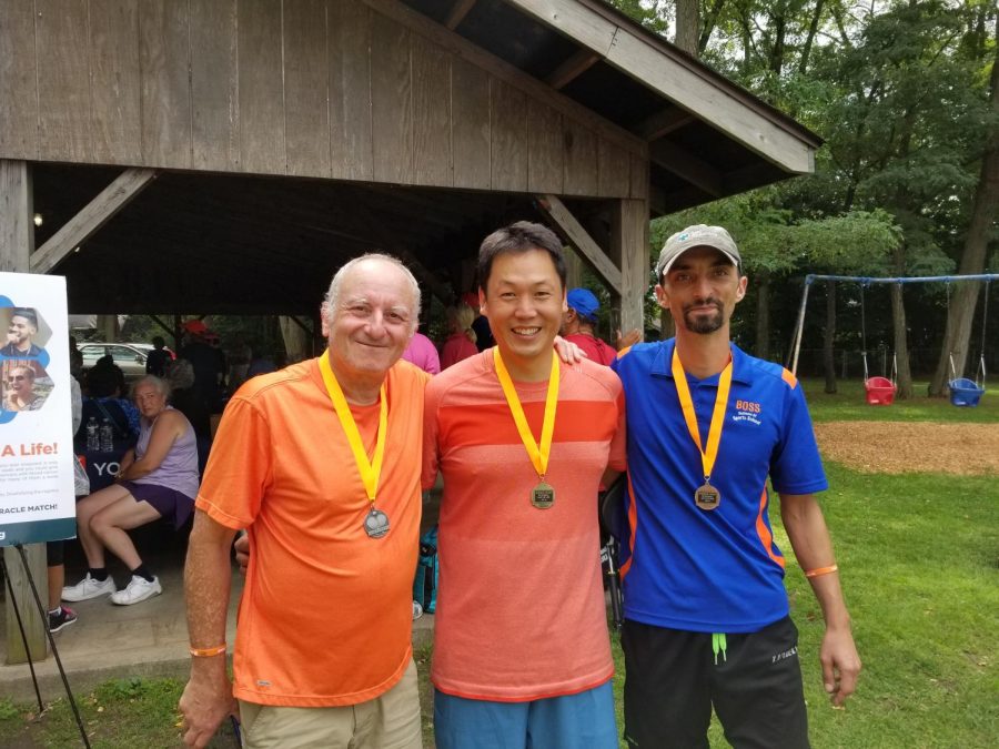 Shin stands with competitors in October 2019 after placing first in the Kingston Classic, a round- robin style doubles pickleball tournament in Kingston, New York.